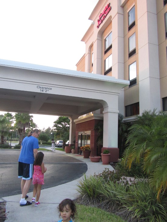 Walking around the Hampton Inn & Suites (Adik loves the signboard)