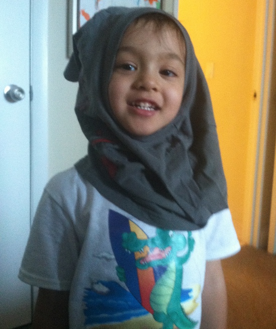 Silly Adik wears a shirt on his head!