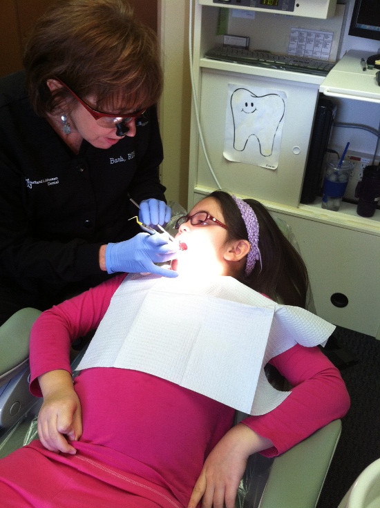 Barb the hygienist/nurse works on Yaya's teeth