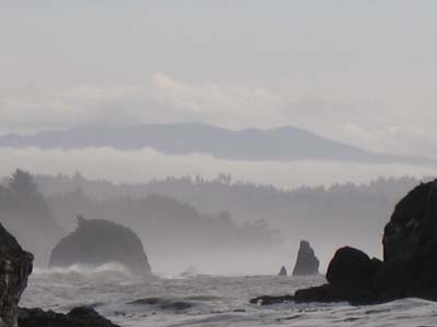 Foggy and mysterious faraway rocks