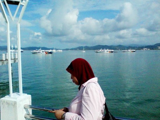 Surrounded by ships near the Kuah Jetty