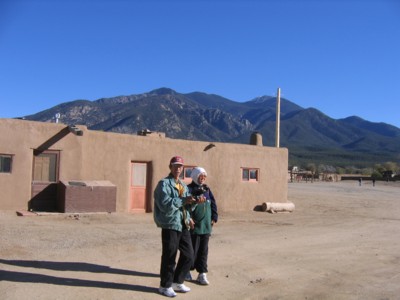 Mak and Abah by the adobe buildings of the pueblo