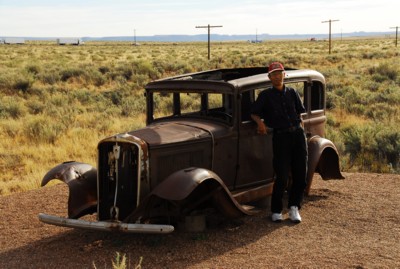 Abah by the antique car on Route 66