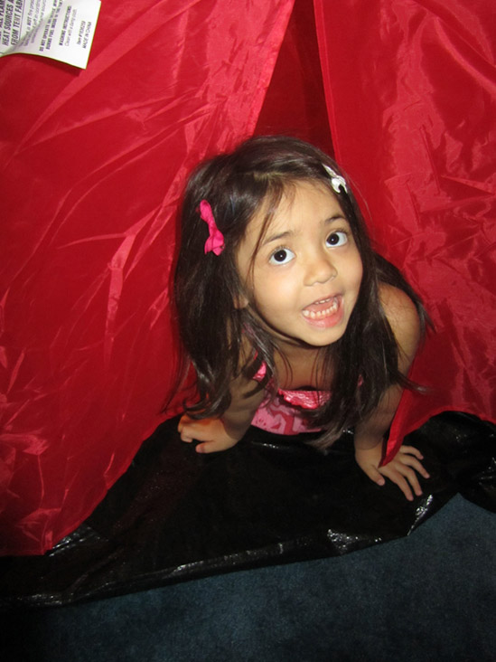 Yaya emerging out of the tent