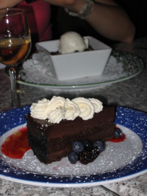 Chocolate cake and bread pudding in the background