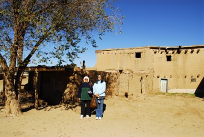 Mak and me by a building close to the entrance of the pueblo